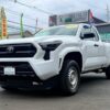 Front view of a white 2023 Toyota truck at Garden State Auto Boutique.
