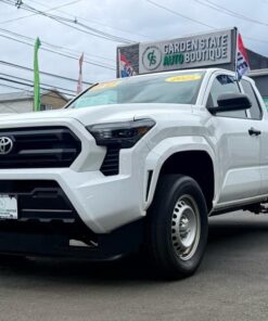 Front view of a white 2023 Toyota truck at Garden State Auto Boutique.