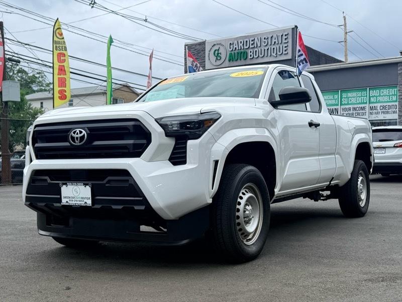 Front view of a white 2023 Toyota truck at Garden State Auto Boutique.
